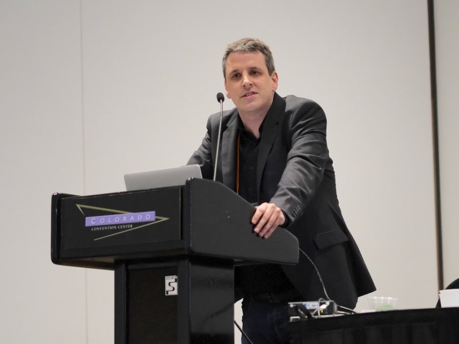 Christian Jetter standing at a lectern